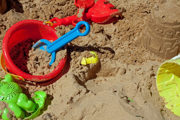 Pit sand with plastic toys
