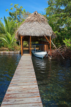 A boathouse with thatched palm roof