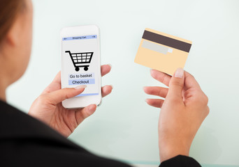 Businesswoman Holding Cellphone And Credit Card