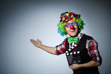 Clown with the movie board