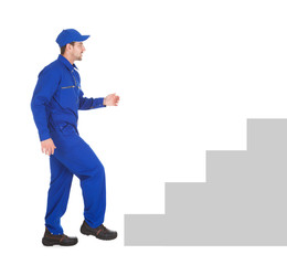 Confident Young Male Cleaner Holding Mop