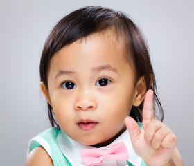 Adorable girl finger point out