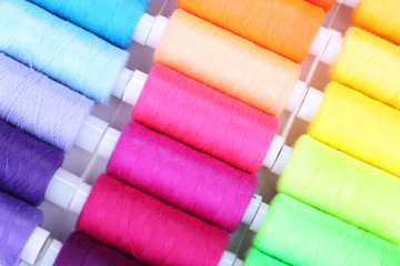 Multicolor sewing threads background