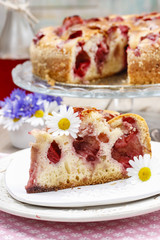 Piece of strawberry cake on ceramic plate