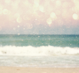 background of blurred beach and sea waves with bokeh lights, vin