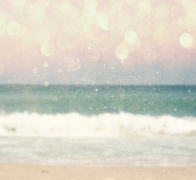 background of blurred beach and sea waves with bokeh lights, vin