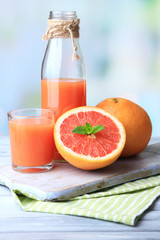 Ripe grapefruits and fresh juice