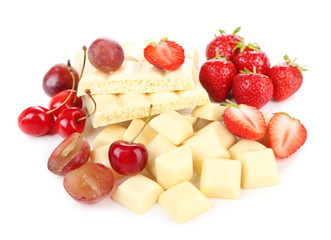 White chopped chocolate bar with fresh berries, isolated