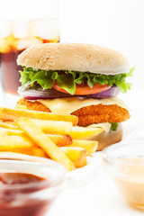 Chickenburger and glass of cola with ice