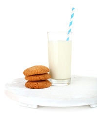 Milk and cookies on wooden tray isolated on white