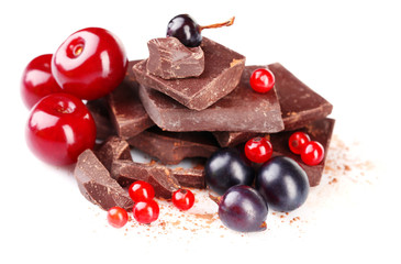Summer berries and chopped chocolate isolated on white