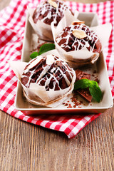 Tasty cupcakes on table close-up