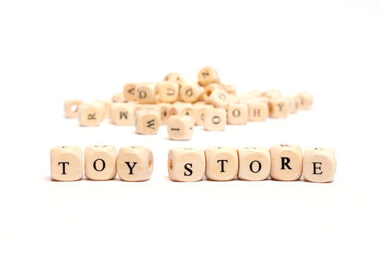 word with dice on white background- toy store