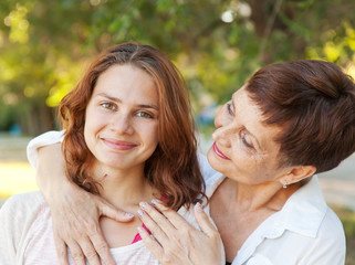 mother and adult daughter in the park