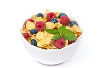 bowl of cornflakes with fresh berries and mint, top view