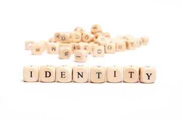 word with dice on white background- identity