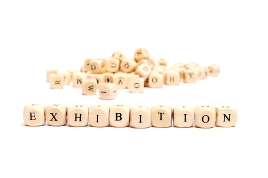 word with dice on white background- exhibition