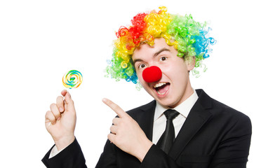 Clown with lollipop isolated on white