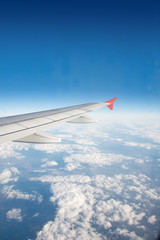 Obraz premium Airplane wing out of window