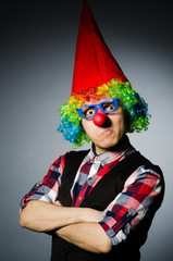 Fototapeta premium Funny clown against the dark background