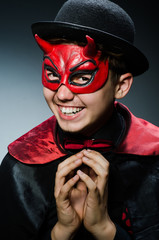 Funny devil against dark background
