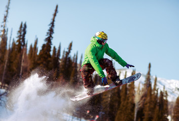Snowboarder jumping