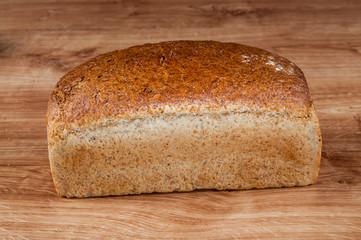 fresh bread on the brown wooden table