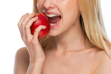 Closeup on teenager eating apple