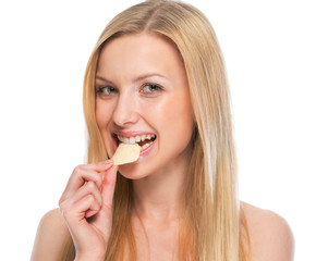 Portrait of happy teenager eating chips
