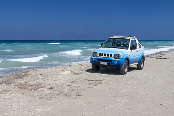 Fototapeta na wymiar The car on the beach. Rhodes. Greece.