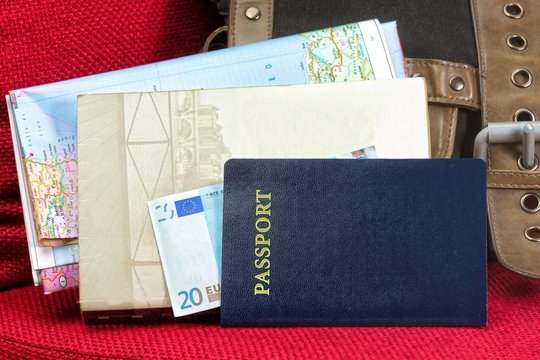 Close up of a traveling documents- passport, ticket, map