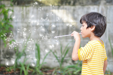 Little boy playing bubble