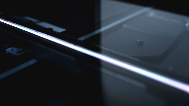 Flat bed computer scanner in action.