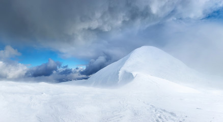 Snowy top during storm. Beautiful winter landscape