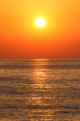 Deep orange color sunset on the beach