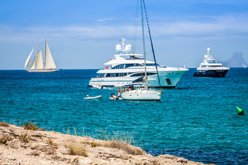Luxury yachts in turquoise beach of Formentera Illetes - 66570449