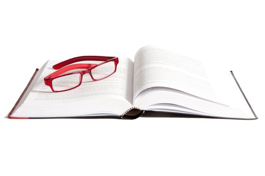 Book and Glasses on a white background