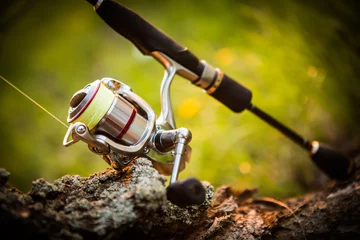 Fotobehang fishing reel. blur background © vitaliy_melnik