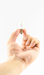 Man hand holding light bulb on white background