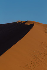 Fototapeta na wymiar Detail of an orange sand dune