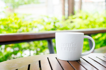 White ceramic mug with stamp word 