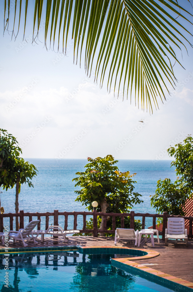 Wall mural tropical resort swimming pool overlooking sea. koh phangan