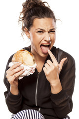 beautiful girl is disgusted by her sandwich