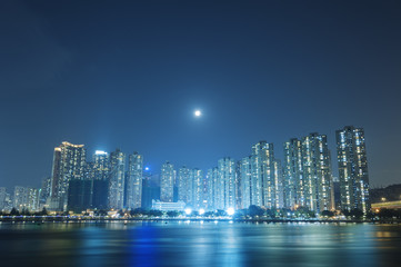 Obraz na płótnie Canvas Full moon over Hong Kong City