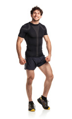 Athletic attractive man after fitness exersise on the white