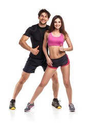 Athletic man and woman after fitness exercise on the white