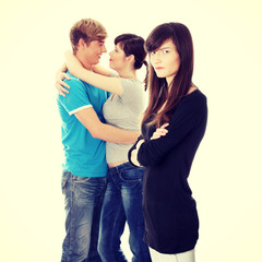 Sad brunette girl jealousy about her friend