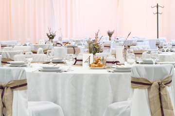 an image of tables setting at a luxury wedding hall