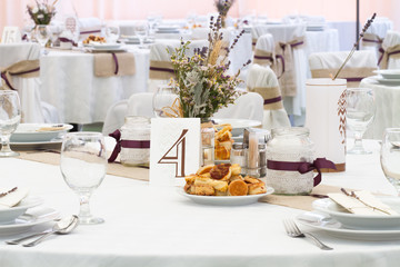 an image of tables setting at a luxury wedding hall