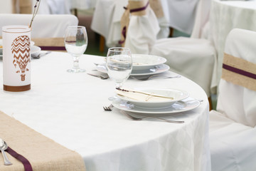 an image of tables setting at a luxury wedding hall